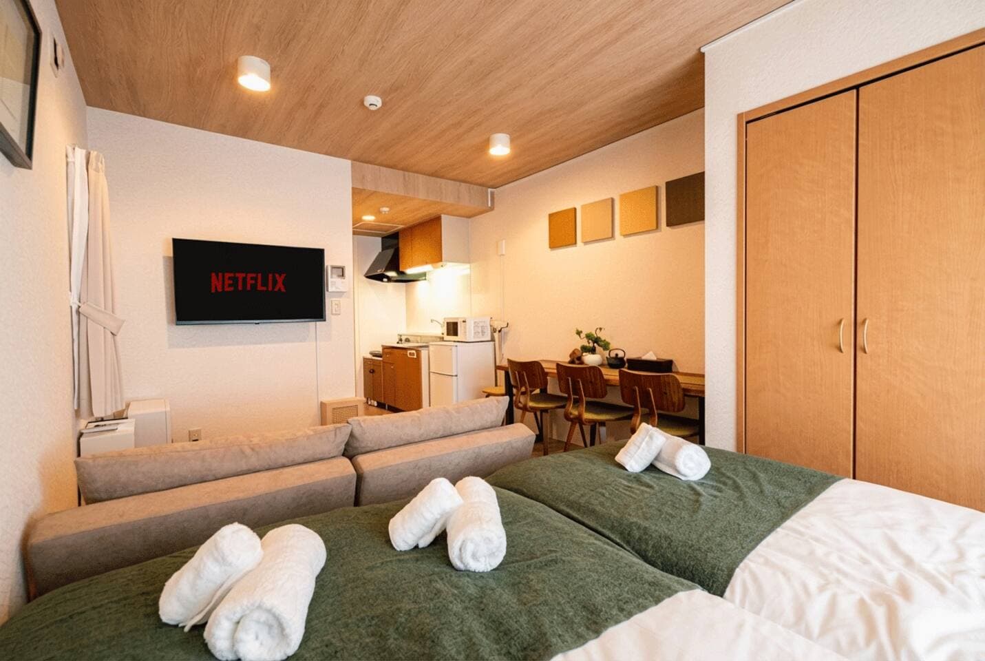 Spacious Studio with Kitchen, Dining, and Living in One
Enjoy a well-designed open-plan room featuring beds, sofa, dining table, and full kitchen—perfect for long stays or working remotely.