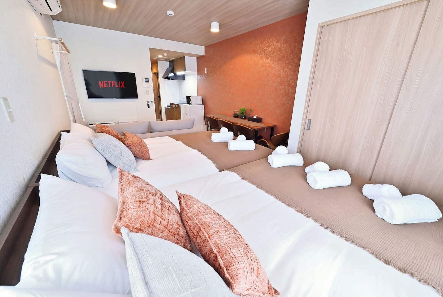 Spacious Studio with Kitchen, Dining, and Living in One
Enjoy a well-designed open-plan room featuring beds, sofa, dining table, and full kitchen—perfect for long stays or working remotely.